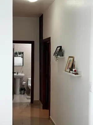a bathroom with a toilet and a sink and a mirror at Margarita 4toB in Marilópez