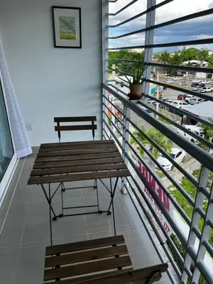 a bench on a balcony with a view of a city at Margarita 4toB in Marilópez