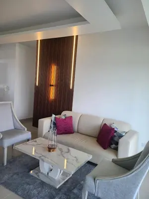 a living room with a couch and a table and chairs at Margarita 4toB in Marilópez