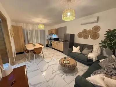 a living room with a couch and a table at Villa con piscina privada en Punta Cana in Punta Cana