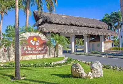 a sign for a white sands golf beach resort at Tranquil 3 Bedroom Apartment - Pool & Private Beach Access in Punta Cana