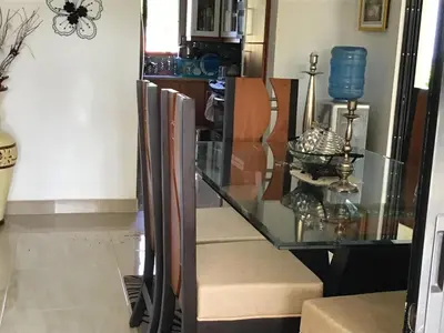 a glass dining room table with a glass counter top at Villa vacances de reve in Sosúa