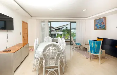 a dining room with a table and chairs at Amare Residences - Beachfront complex in Las Terrenas