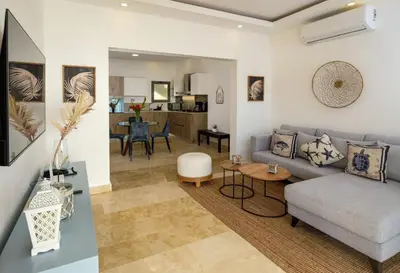 a living room with a couch and a table at Amare Residences - Beachfront complex in Las Terrenas