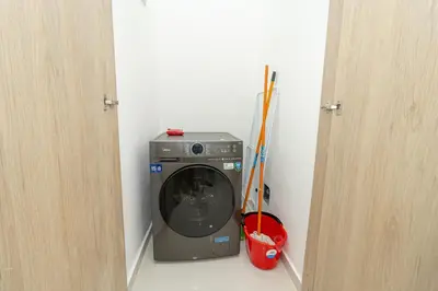 a washing machine in the corner of a room at Modern 1BR Retreat Central Bayahibe Sunshine in San Rafael del Yuma