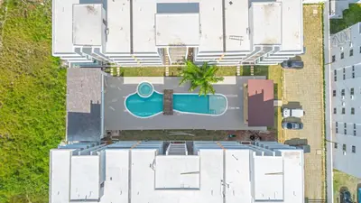 an overhead view of a building with a swimming pool at Modern 1BR Retreat Central Bayahibe Sunshine in San Rafael del Yuma