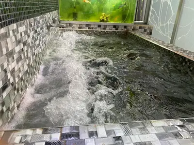 a bath tub filled with water in a bathroom at Ideal with a Jacuzzi, pool in Colorado