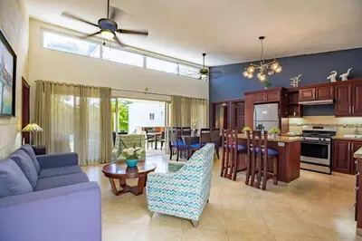 a kitchen and living room with a couch and a table at Casa Linda Villa 722 - Sosua - BBQ - Washer in Sosúa