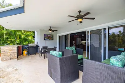 a living room with chairs and a ceiling fan at Casa Linda Villa 722 - Sosua - BBQ - Washer in Sosúa