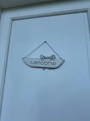 a sign on the door of a restaurant at Juan Dolio House 2BR y Patio in Los Corrales
