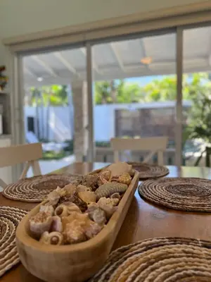 a wooden table with a bowl of food on it at 2BR Juan Dolió House in Juan Dolio