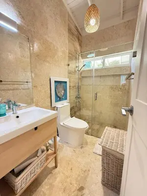 a bathroom with a sink and a toilet and a shower at 2BR Juan Dolió House in Juan Dolio
