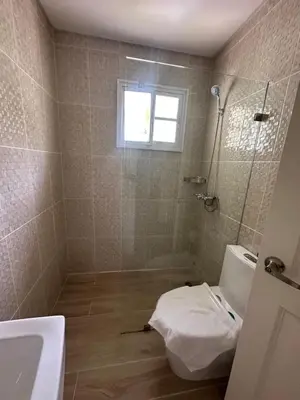 a bathroom with a shower and a toilet and a sink at The best place to rest, Arenas del Caribe in Punta Cana