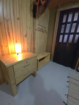 a bedroom with a desk with a lamp on it at La Casita De La Cueva in Cabo Rojo