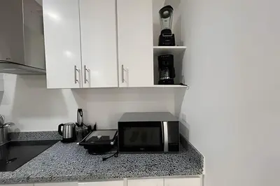 a microwave sitting on a counter in a kitchen at Sweet Home Bayahibe in Bayahibe