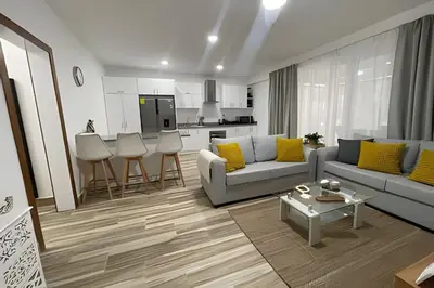 a living room with a couch and a table at Sweet Home Bayahibe in Bayahibe