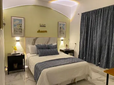 a bedroom with a king sized bed in a room at Little Room Airport By Merengue House in Monte Adentro