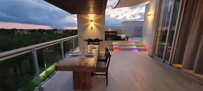 a wooden table on the balcony of a house at Vibe Residence Gorgeous Penthouse with Jacuzzi & outstanding Sea & Natural Preserve view in La Laguna