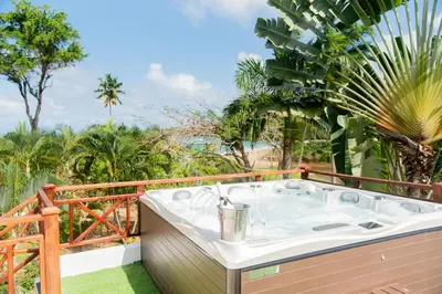 a hot tub on the balcony of a resort at Lives off Colorada Beach in La Colmena