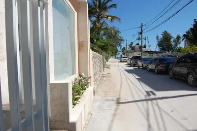a building with a window on the side of a street at Villas Princesa Beach Apartments in Punta Cana