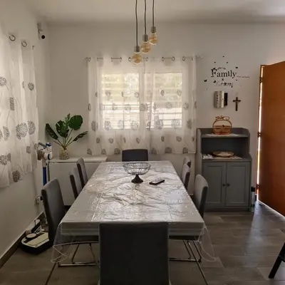 a dining room with a table and chairs at Casa Madi in Bayahibe