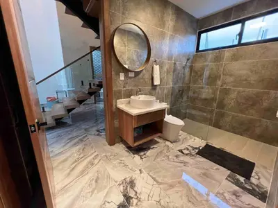 a bathroom with a sink and a mirror at Elegant, Modern style Villa in Playa Nueva Romana2 in Boca del Soco