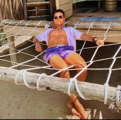 a woman sitting on top of a net at Punta Cana Ecolodge In front of the beach Lavacama Costa Arrecife by BTC Crypto Group in El Eslabón