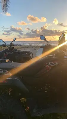 a group of motorcycles parked on the beach at ATV Camping in Punta Cana in Punta Cana