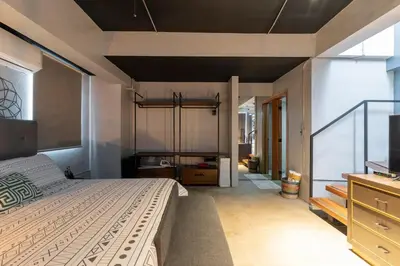 a bedroom with a large bed and a television at PH Loft, 3floors,Private Jacuzzi n terrace,Kingbed in Santo Domingo