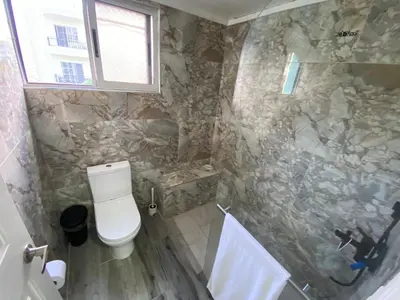 a bathroom with a toilet and a shower at Amazing apartment pool and beach life in los corals punta cana in Punta Cana