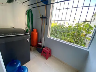 a small kitchen with a window and aperature at Amazing apartment pool and beach life in los corals punta cana in Punta Cana