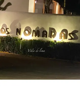 a sign that says norats nomads on a wall at Villa de Lima in Las Terrenas