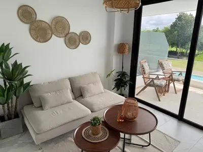 a living room with a couch and a table at Canarock Beach Club in Punta Cana