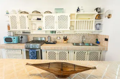 a kitchen with a sink and a counter top at La Dolce Vita in Las Terrenas
