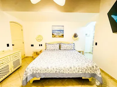 a bedroom with a bed and a dresser at La Dolce Vita in Las Terrenas