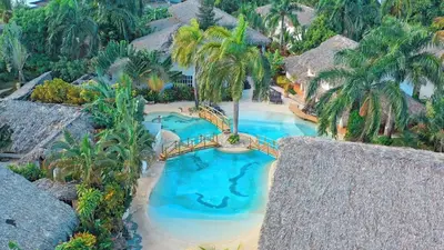 an aerial view of a swimming pool in a resort at Villa La Palmeras - 8 Pax, 5 min de La Playa in Las Galeras