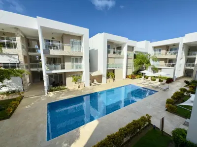 an aerial view of an apartment complex with a swimming pool at Casa Mulata Paseo del Mar 2 Pool & Playa in Punta Cana