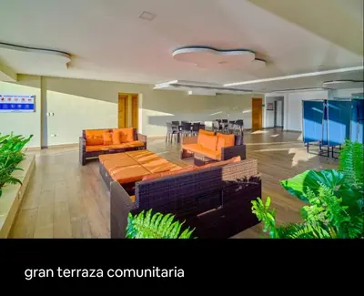 a living room with couches and tables and chairs at Ventanas del mar in Los Corrales