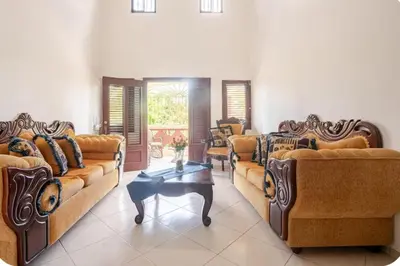 a large living room with couches and a table at Rio San Juan,Spacious,Local,3 Bedroom in Río San Juan