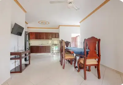 a kitchen and dining room with a table and chairs at Rio San Juan,Spacious,Local,3 Bedroom in Río San Juan