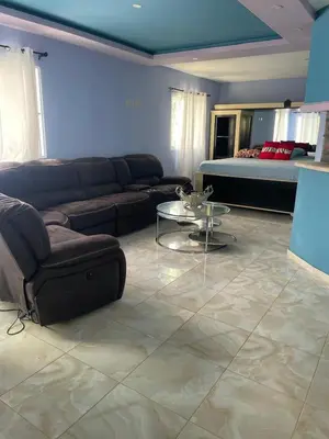 a living room with a couch and a table at Villa anastacia in Sabaneta de Yásica