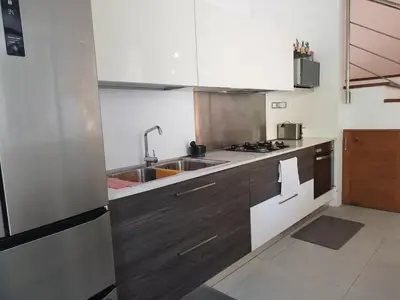 a kitchen with a sink and a counter top at Comfort one step away from the beach in Las Terrenas