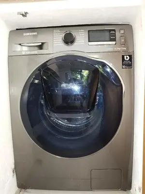 a front view of a washing machine in a room at Comfort one step away from the beach in Las Terrenas