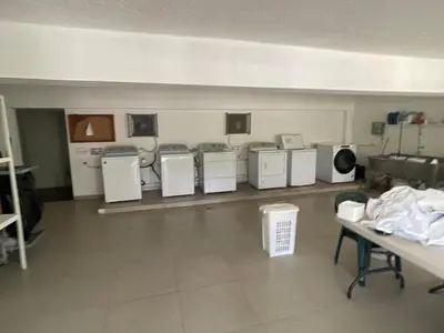 a room with several washers and dryers in a room at Luxury apartment Playa Dorada in Puerto Plata
