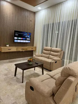a living room with a couch and two chairs and a tv at Villa para grupos in Concepción de La Vega