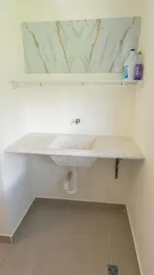 a bathroom sink with a marble counter top at Agua Azul Boca Chica Accommodation in Andrés