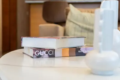 three books sitting on a table in a living room at Apartment in Santo Domingo in Santo Domingo