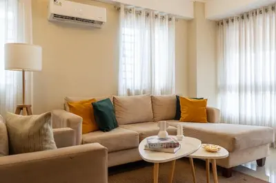 a living room with a couch and a table at Apartment in Santo Domingo in Santo Domingo