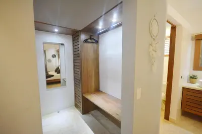 a hallway with a walk in closet and a mirror at House with pool 300 m from Las Ballenas beach in Las Terrenas