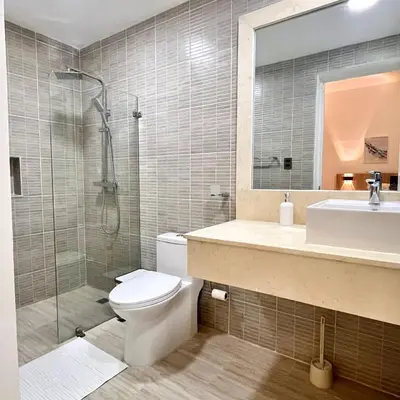 a bathroom with a toilet and a sink and a shower at Maple Beach, apartamento en Punta Cana in Punta Cana
